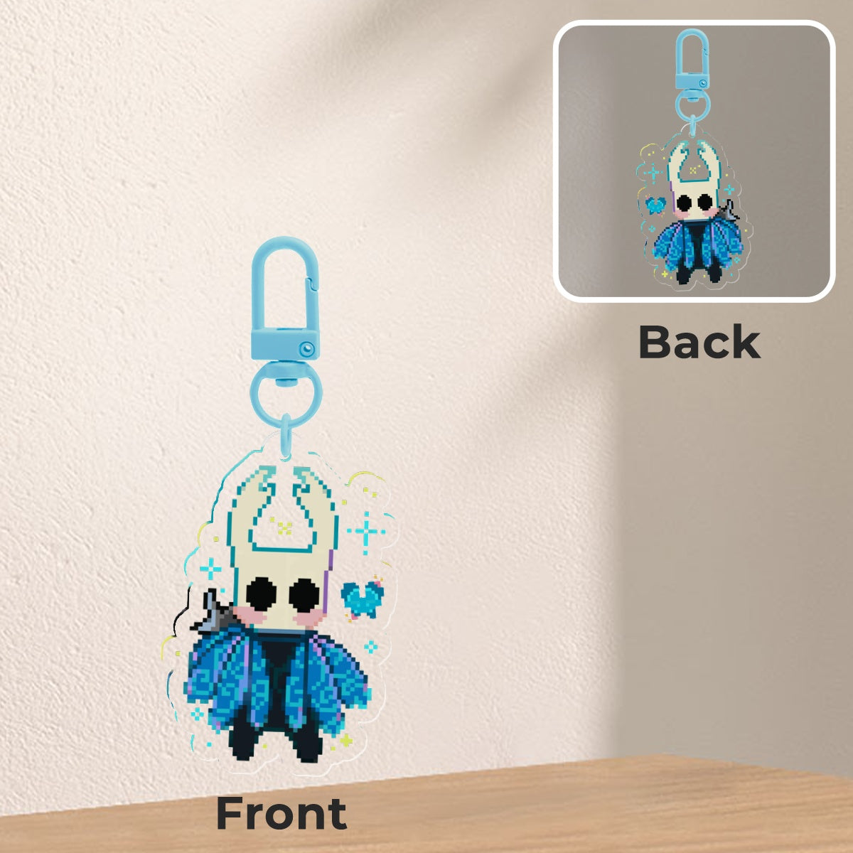 Keychain with character design on front and back, on a neutral background