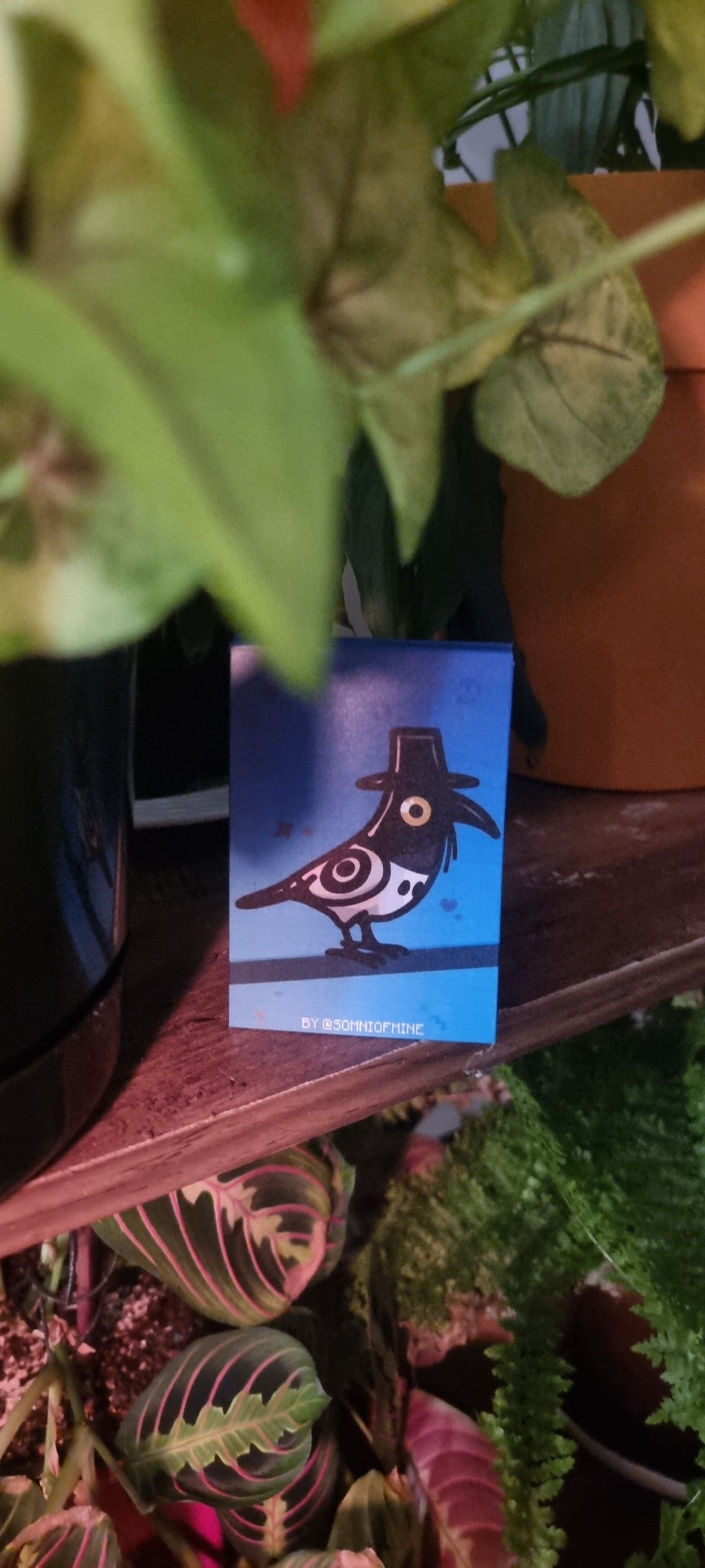 Decorative mask with Sussie from KDH design on a colorful background with plants